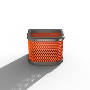 May include: A square air filter with a honeycomb pattern in bright orange. The filter is encased in a dark gray frame with rounded corners. The object casts a shadow on a white background.