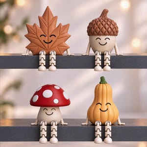 May include: Four decorative shelf-sitting figurines featuring a brown maple leaf, a brown acorn, a red mushroom with white spots, and a yellow squash. Each figure has a smiling face, cream-colored arms, and dangling legs with articulated joints.