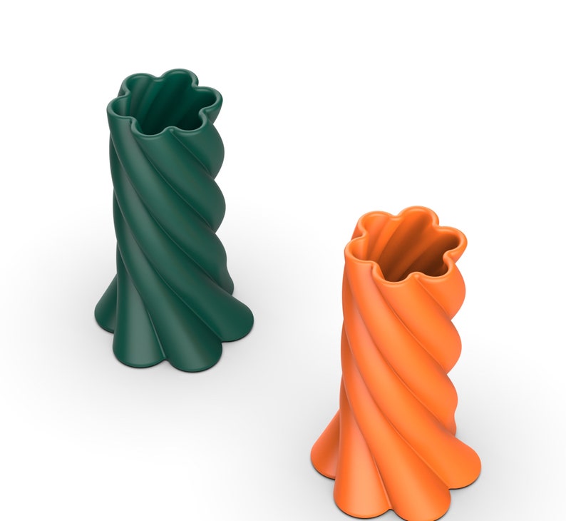 May include: Two ceramic vases with a twisted design. The vase on the left is green and the vase on the right is orange.