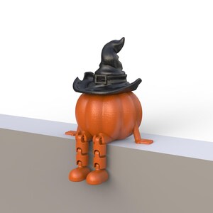 May include: A whimsical orange pumpkin figure wearing a black witch hat. The pumpkin has orange legs and feet, and is sitting on a white and gray surface. A fun Halloween decoration.