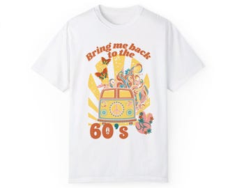May include: White t-shirt with a retro graphic design featuring a yellow van with peace signs, butterflies, and the text "Bring me back to the 60's".