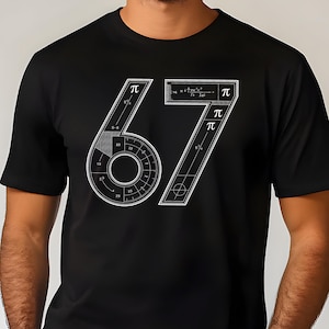 May include: Black t-shirt with a white graphic design of the number 67, incorporating mathematical symbols and diagrams. The design includes the pi symbol and a circular protractor-like element. The shirt is short-sleeved.