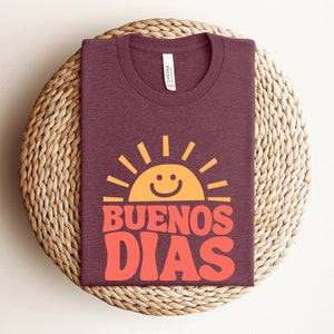 a t - shirt that says buenos dias on it