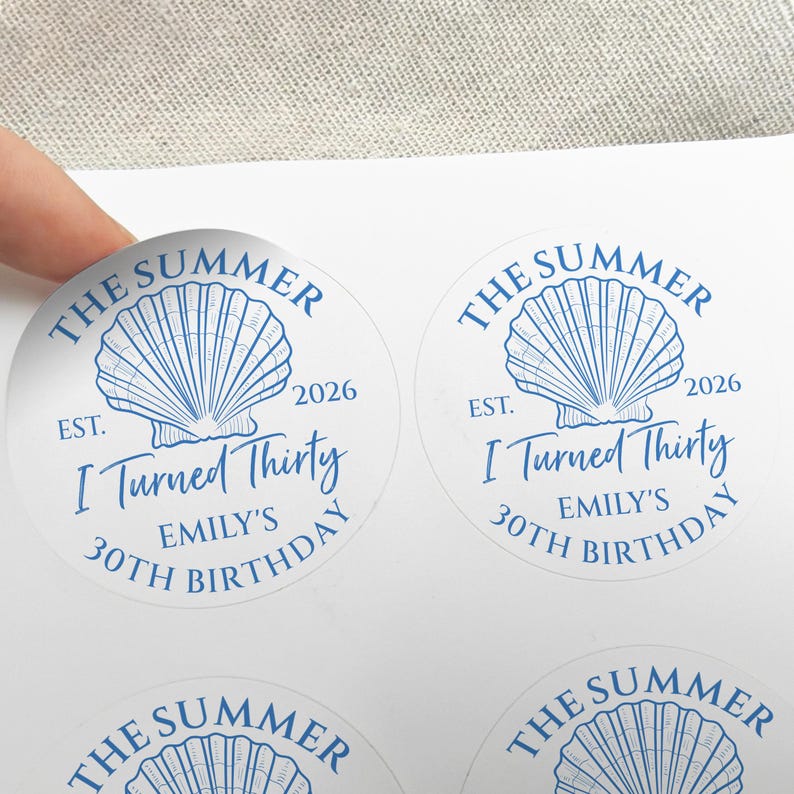 May include: Round stickers with a blue seashell design and the text "The Summer", "I Turned Thirty", and "Emily's 30th Birthday". The stickers also include the year "2026".