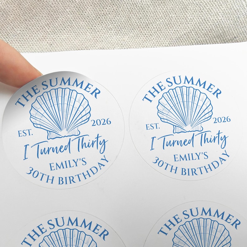 May include: Round stickers with a blue seashell design and the text "The Summer", "I Turned Thirty", and "Emily's 30th Birthday". The stickers also include the year "2026".