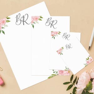 May include: Set of four stationery note cards featuring pink floral designs and the monogram "BR" in black script.