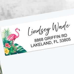 May include: Pink flamingo with tropical leaves and flowers on a white return address label. Lindsey Wade, 8868 Griffin Rd, Lakeland, FL 33805.