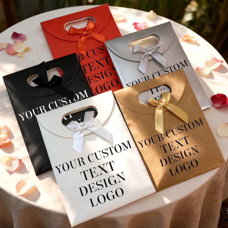May include: An assortment of gift bags in red, black, silver, white, and gold. Each bag has a handle and a ribbon. The bags have the text "YOUR CUSTOM TEXT DESIGN LOGO" printed on them.
