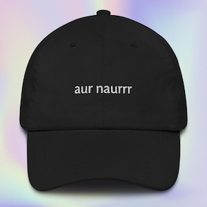 May include: Black baseball cap with white embroidered text that reads "aur naurrr".