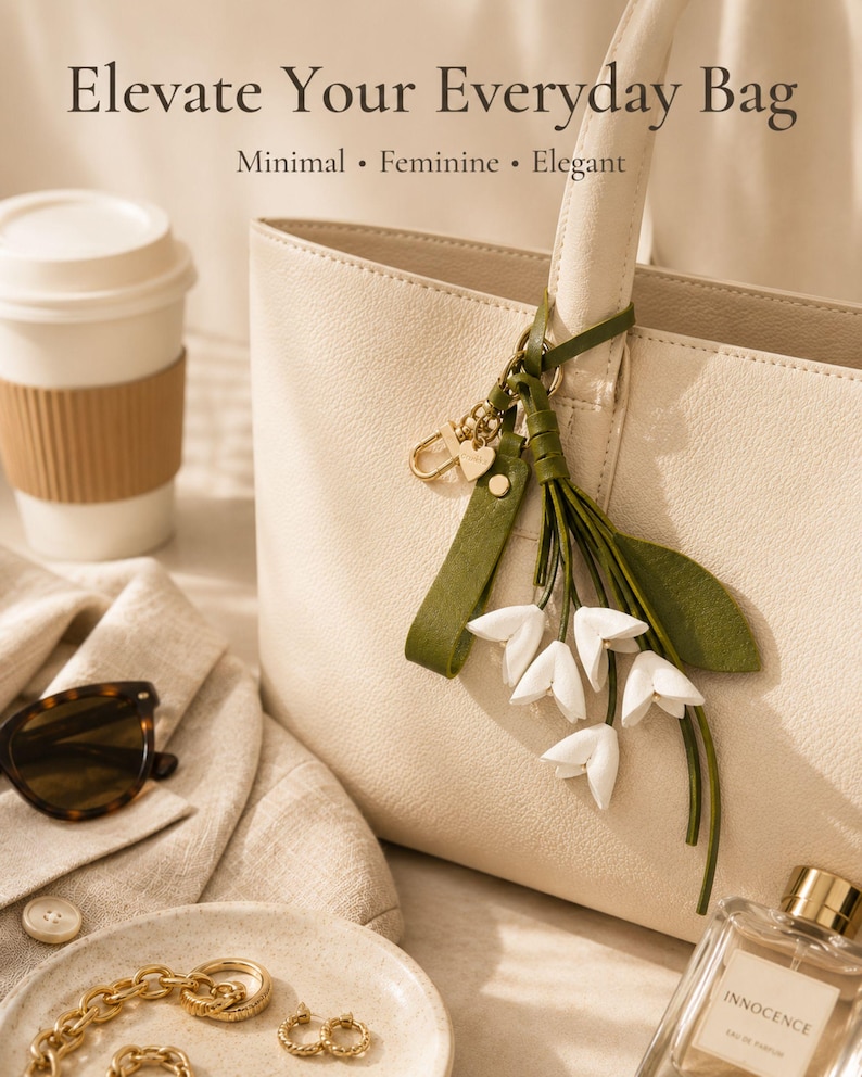 White floral bag charm with leather flowers and gold hardware, elegant purse charm accessory for women, luxury handbag charm with tassel, aesthetic white keychain for tote bag, trendy flower purse accessory, feminine handbag decoration, modern leather floral keychain, gift for her, cute white purse charm, boutique style bag accessory, minimal elegant keychain for handbags, stylish floral charm for purse, luxury fashion bag accessory