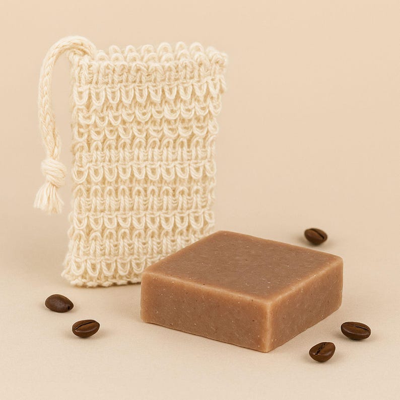Handmade natural soap presented with reusable exfoliating soap bag; eco-friendly spa gift for women, birthday gift, and self-care essential.