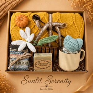 Fall gift box for women, handmade pumpkin soy candle, ceramic mug, artisan soap, decorative glass match bottle, plush teddy bear and cozy autumn socks beautifully arranged in boutique gift packaging. Cozy gift basket and autumn care package perfect as a blanket gift, hygge self care gift, comfort gift, thinking of you gift, appreciation gift, housewarming gift, Thanksgiving hostess gift, birthday gift, get well soon gift and seasonal gift for mom, grandma, sister, friend or coworker.