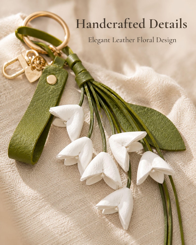 White floral bag charm with leather flowers and gold hardware, elegant purse charm accessory for women, luxury handbag charm with tassel, aesthetic white keychain for tote bag, trendy flower purse accessory, feminine handbag decoration, modern leather floral keychain, gift for her, cute white purse charm, boutique style bag accessory, minimal elegant keychain for handbags, stylish floral charm for purse, luxury fashion bag accessory