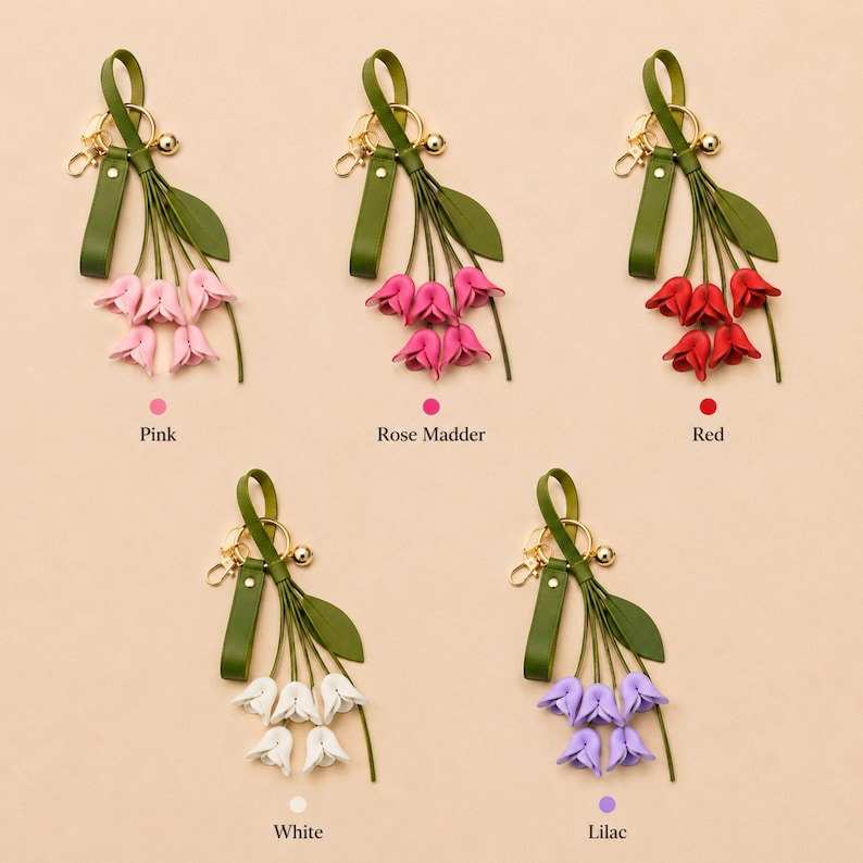 White floral bag charm with leather flowers and gold hardware, elegant purse charm accessory for women, luxury handbag charm with tassel, aesthetic white keychain for tote bag, trendy flower purse accessory, feminine handbag decoration, modern leather floral keychain, gift for her, cute white purse charm, boutique style bag accessory, minimal elegant keychain for handbags, stylish floral charm for purse, luxury fashion bag accessory