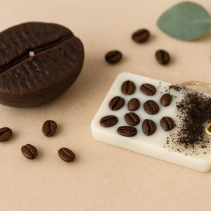 Close-up of handmade coffee bean shaped soy candle, warm cozy aesthetic, perfect gift for coffee lovers, spa gifts, and home décor.
