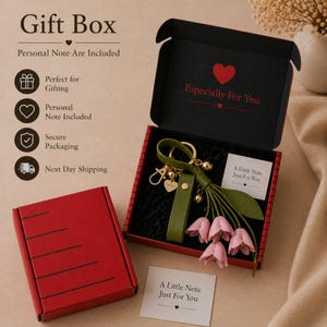 Luxury botanical leather bag charm featuring blush pink leather flowers, olive green leather leaves, decorative tassel, wrist loop, premium gold hardware, and elegant handbag accessory. Handmade floral purse charm designed for luxury handbags, designer inspired totes, shoulder bags, crossbody purses, woven beach bags, and everyday handbags. Arrives beautifully packaged in a signature gift box, making a ready to gift birthday gift, Mother's Day gift, bridesmaid gift, Christmas gift for women.
