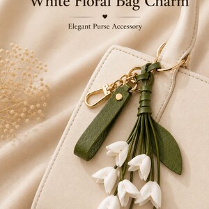 White floral bag charm with leather flowers and gold hardware, elegant purse charm accessory for women, luxury handbag charm with tassel, aesthetic white keychain for tote bag, trendy flower purse accessory, feminine handbag decoration, modern leather floral keychain, gift for her, cute white purse charm, boutique style bag accessory, minimal elegant keychain for handbags, stylish floral charm for purse, luxury fashion bag accessory