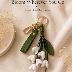 White floral bag charm with leather flowers and gold hardware, elegant purse charm accessory for women, luxury handbag charm with tassel, aesthetic white keychain for tote bag, trendy flower purse accessory, feminine handbag decoration, modern leather floral keychain, gift for her, cute white purse charm, boutique style bag accessory, minimal elegant keychain for handbags, stylish floral charm for purse, luxury fashion bag accessory