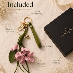Luxury botanical leather bag charm featuring blush pink leather flowers, olive green leather leaves, decorative tassel, wrist loop, premium gold hardware, and elegant handbag accessory. Handmade floral purse charm designed for luxury handbags, designer inspired totes, shoulder bags, crossbody purses, woven beach bags, and everyday handbags. Arrives beautifully packaged in a signature gift box, making a ready to gift birthday gift, Mother's Day gift, bridesmaid gift, Christmas gift for women.