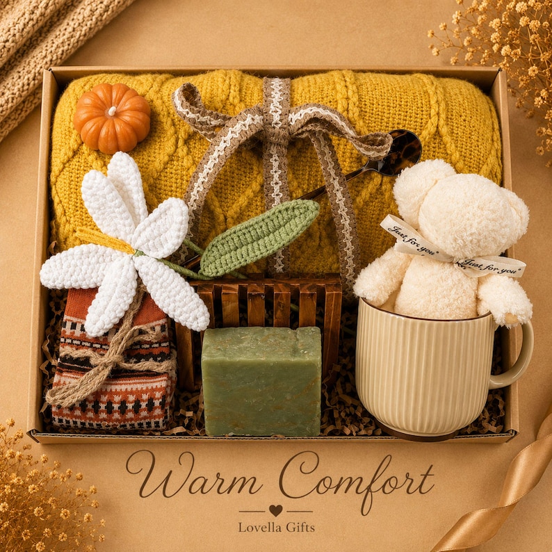 Fall gift box for women, handmade pumpkin soy candle, ceramic mug, artisan soap, decorative glass match bottle, plush teddy bear and cozy autumn socks beautifully arranged in boutique gift packaging. Cozy gift basket and autumn care package perfect as a blanket gift, hygge self care gift, comfort gift, thinking of you gift, appreciation gift, housewarming gift, Thanksgiving hostess gift, birthday gift, get well soon gift and seasonal gift for mom, grandma, sister, friend or coworker.