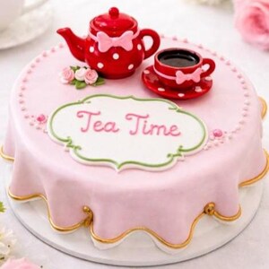 May include: A round cake covered in smooth light pink fondant with a scalloped edge and gold trim. The top features a red teapot with white polka dots and a pink bow, a matching teacup, small pink sugar flowers, and a white plaque reading Tea Time.