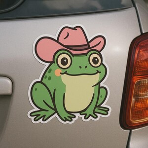 Divertente adesivo a forma di rana con cappello da cowboy rosa per laptop, auto e camper. Regalo per gli amanti degli animali e dell'umorismo un po' eccentrico.