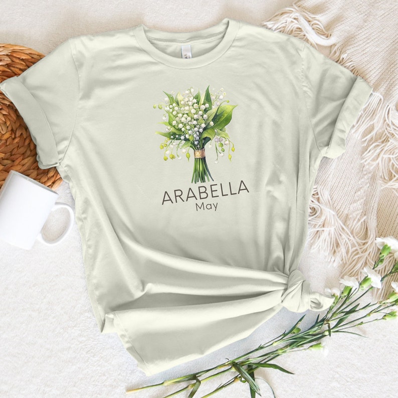 Add a touch of nature to your wardrobe with our customizable design featuring your first name, birth month flower, and birth month. Whether you are a lover of flowers or searching for a unique and meaningful gift for Mothers Day or bridesmaid gifts.