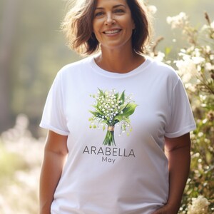 Add a touch of nature to your wardrobe with our customizable design featuring your first name, birth month flower, and birth month. Whether you are a lover of flowers or searching for a unique and meaningful gift for Mothers Day or bridesmaid gifts.