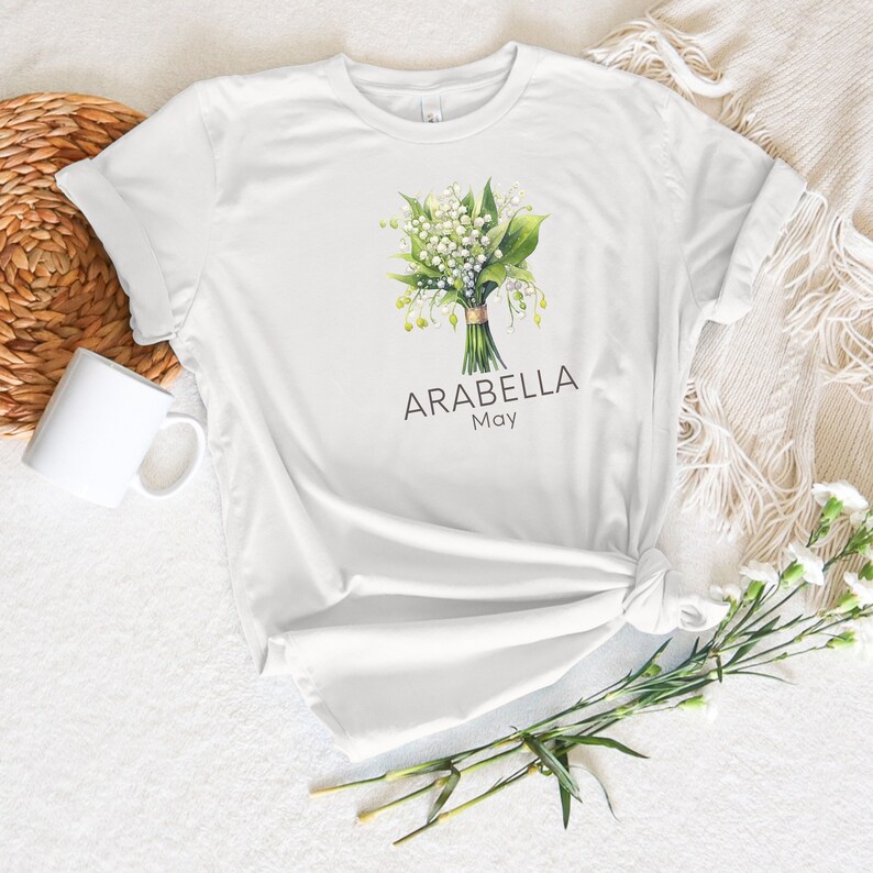 Add a touch of nature to your wardrobe with our customizable design featuring your first name, birth month flower, and birth month. Whether you are a lover of flowers or searching for a unique and meaningful gift for Mothers Day or bridesmaid gifts.
