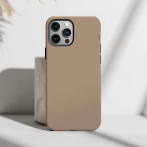 Embrace the beauty of nature with our Soft Mocha Brown Phone Case.  Designed with nature in mind, this solid color phone case gift features a solid flat surface print perfect for anyone who loves a touch of natures aesthetic