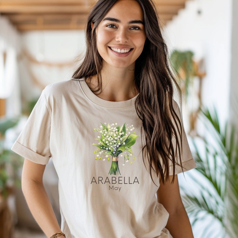 Add a touch of nature to your wardrobe with our customizable design featuring your first name, birth month flower, and birth month. Whether you are a lover of flowers or searching for a unique and meaningful gift for Mothers Day or bridesmaid gifts.
