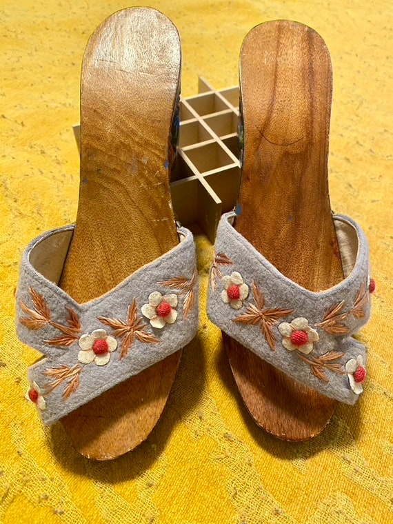 Hand-carved and painted wooden slide sandals