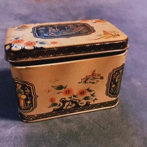 Antique hinged top tin container from the Mid-Century era
