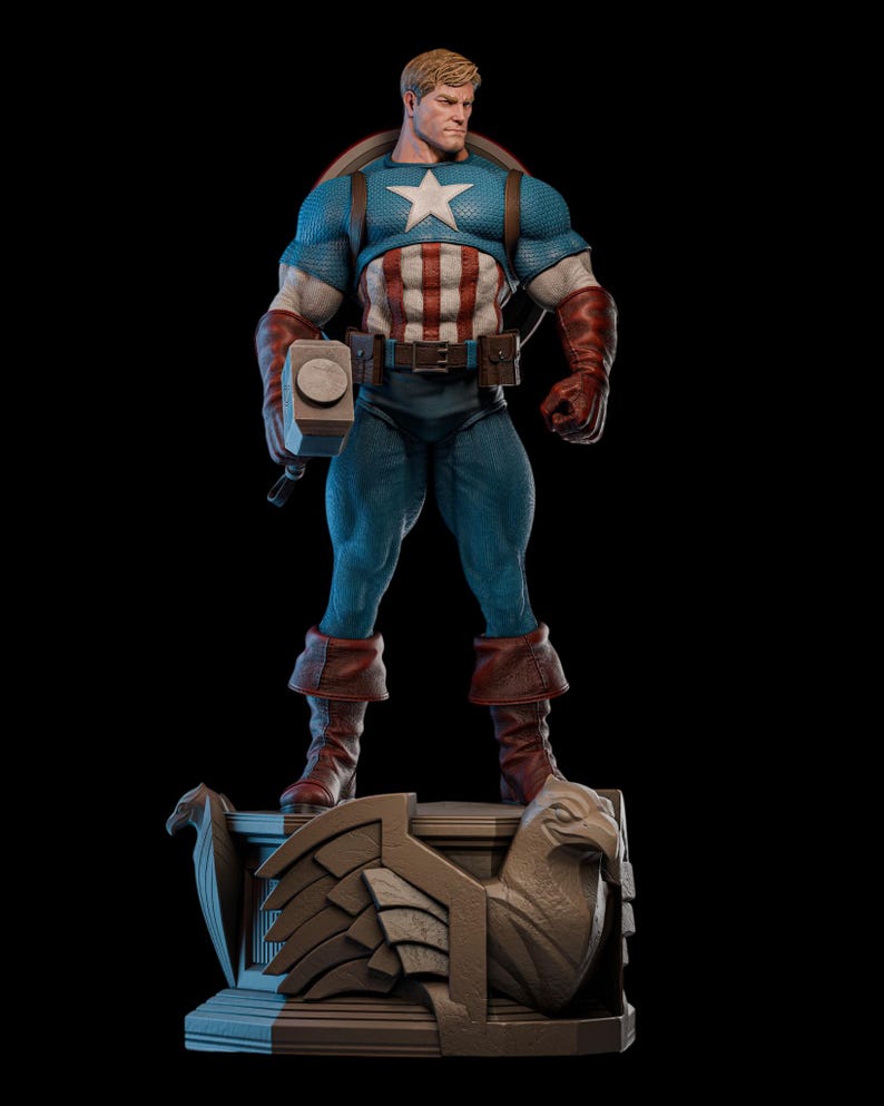 May include: A detailed statue of Captain America in a heroic pose, holding a hammer. The figure wears a blue and white costume with a star emblem and stands on a decorative base with an eagle design. The statue has a muscular build and is set against a black background.