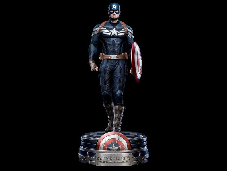 May include: A detailed statue of Captain America in a dynamic pose, holding his iconic shield. The figure is clad in a blue and white costume with a star emblem. The base features the Captain America shield and the text "CAPTAIN AMERICA: THE WINTER SOLDIER".