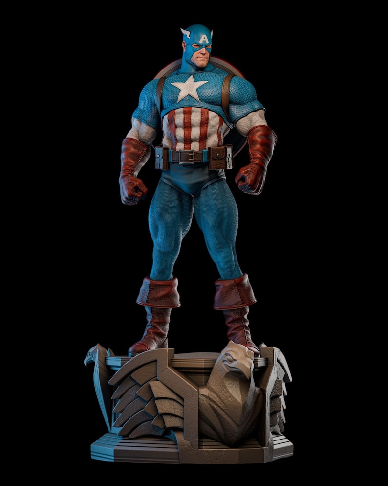 May include: A detailed statue of Captain America, standing on a decorative base. The figure is in a classic pose, wearing a blue and white costume with a star emblem. The statue features a shield and is set against a black background.