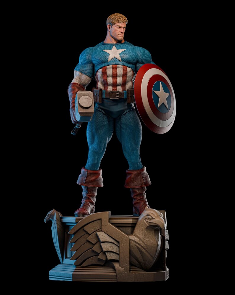 May include: A detailed figurine of Captain America, standing on a decorative base. He wears a blue and white costume, holding a hammer and shield. The shield features a white star on a red and white background. The base has an eagle design.