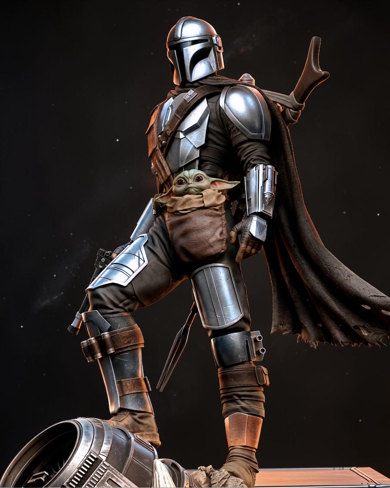 May include: A detailed figurine of The Mandalorian, clad in silver armor and a dark cape, with Grogu in a pouch. The figure stands on a metallic base, showcasing intricate details and a dynamic pose, perfect for Star Wars fans.