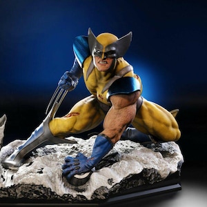 May include: A yellow and blue action figure of Wolverine, a Marvel Comics superhero, in a crouching pose with claws extended. The figure is posed on a rocky base.
