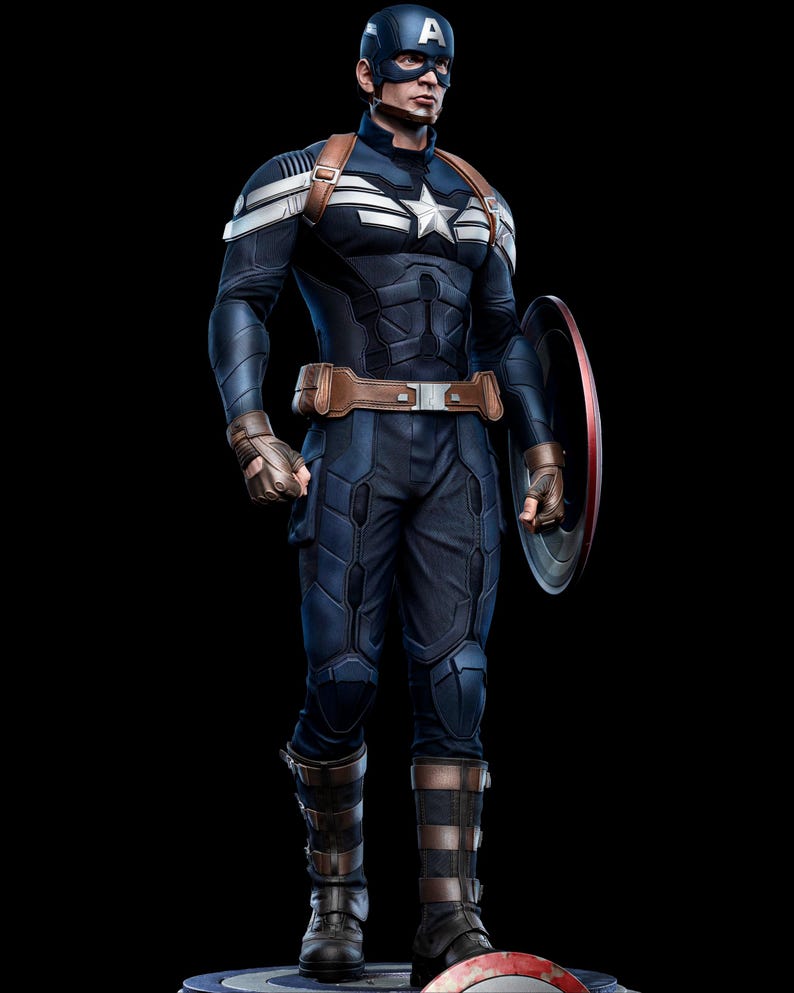 May include: A full-body image of Captain America in a navy blue and white costume, holding his shield. The costume features a white star on the chest, brown straps, and a blue helmet with a white "A". The shield is red, white, and blue.