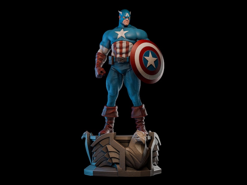 May include: A detailed statue of Captain America, standing on a decorative base. The figure is in a classic pose, holding a shield with a white star on a red and white background. The costume is blue, red, and white.