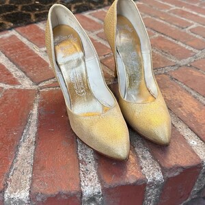 Vintage gold stiletto pumps, Deliso Debs, size 7 AA. Pre-owned but good condition