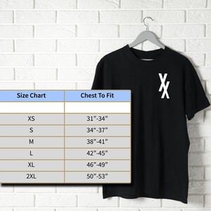 May include: Size chart for a black t-shirt with a white "X" graphic. The chart shows sizes XS through 2XL with corresponding chest measurements in inches.