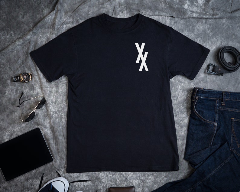May include: A black t-shirt with a white "XX" graphic on the chest.