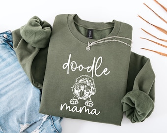 May include: A green sweatshirt with the text "doodle mama" and a doodle dog graphic.