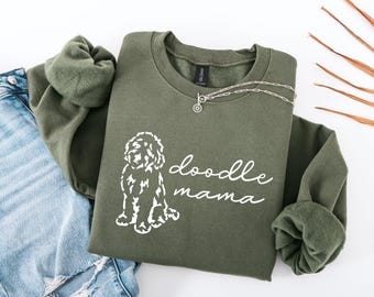 May include: A green sweatshirt with the text "doodle mama" and a white doodle dog illustration.