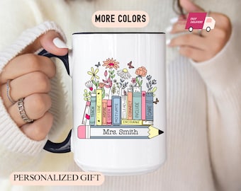 May include: White ceramic mug with a black handle and rim, featuring a colorful floral and book design. The design includes the words "TEACH, LOVE, LISTEN, MOTIVATE, LEAD, CONNECT, INCLUDE, CARE" and the name "Mrs. Smith" on a pencil.