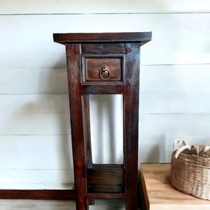 Antique end table with drawer outlet