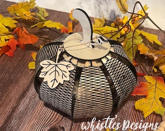 May include: A wooden pumpkin with a black and white geometric pattern. The pumpkin has a leaf design on the side and a small wooden stem. The text "SVG FILE ONLY" is visible at the top of the image. The pumpkin is sitting on a wooden surface.