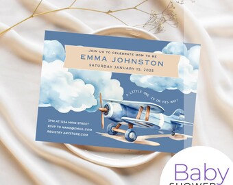 May include: Blue and white baby shower invitation with a watercolor illustration of a blue airplane flying through clouds. The text reads "Join us to celebrate Mom to be Emma Johnston, Saturday January 15, 2025. A little one is on his way!"  2PM at 1234 Main Street, RSVP to name@email.com, Registry anystore.com.